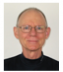 Photo of John Sample, smiling man, short straight gray hair, glasses