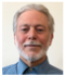 Photo of Richard Leeds, smiling man, short straight gray hair